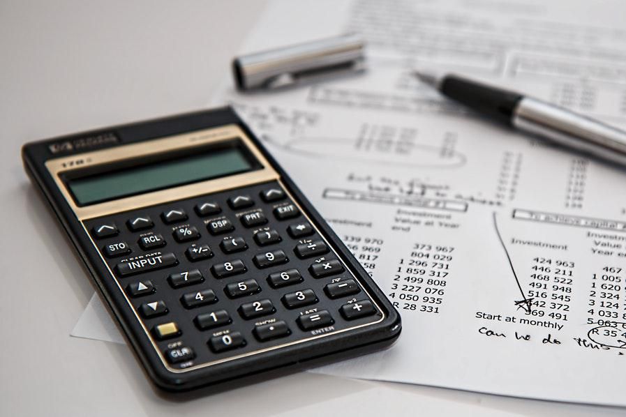 calculator alongside financial report