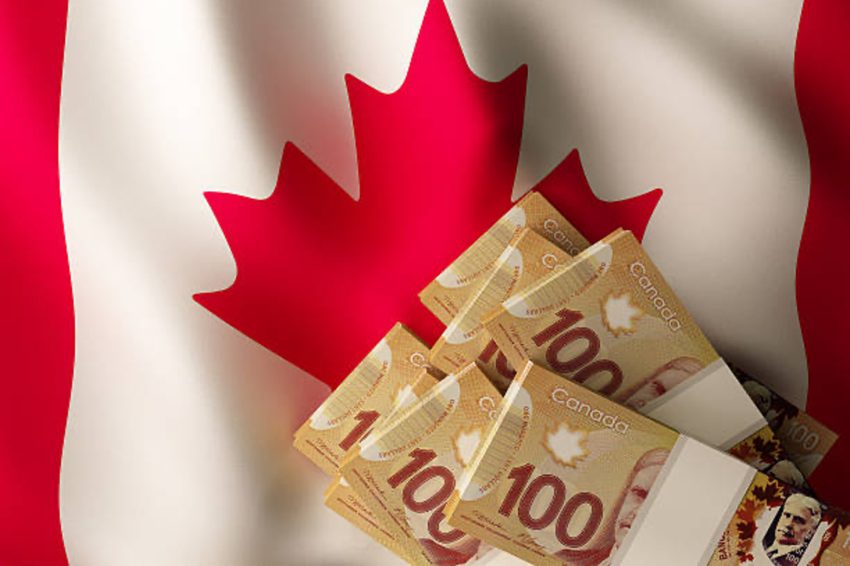 Canadian $100 bills and Canadian flag.