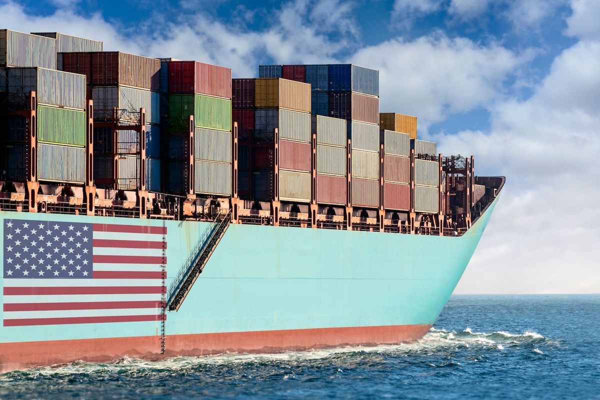 Cargo ship with US flag on side.