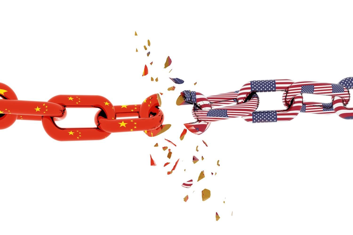 Chains with Chinese and American flags breaking apart, symbolizing division.