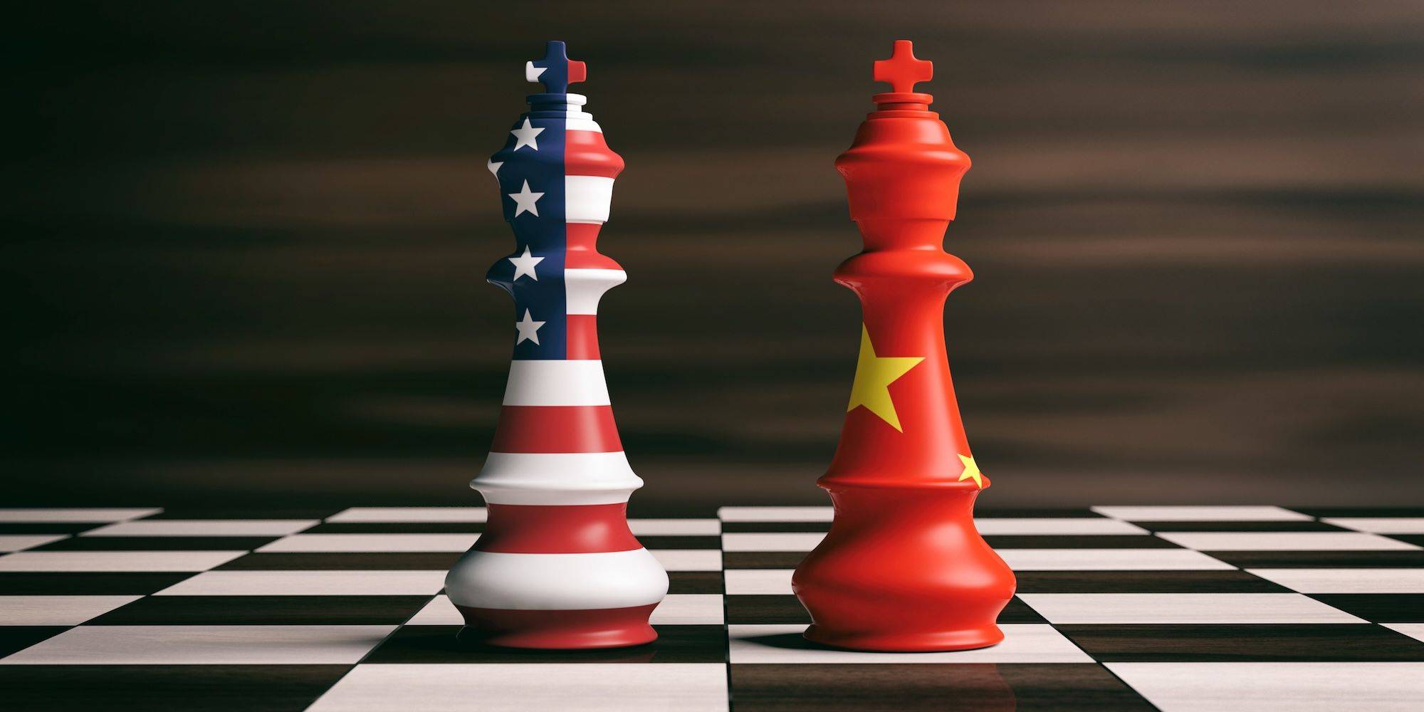Chess kings with US and China flags on a chessboard.