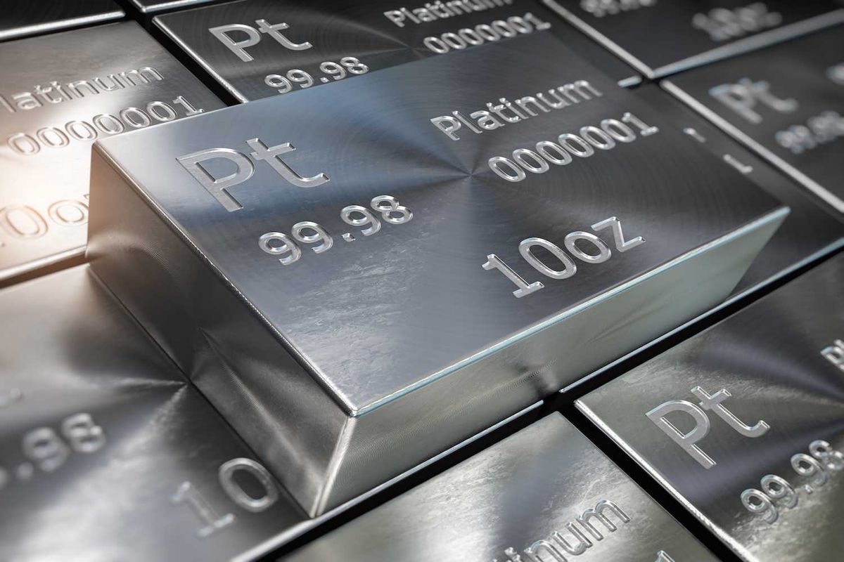 Close-up of silver platinum bars labeled "Pt 99.98" and "10 oz" stacked together.