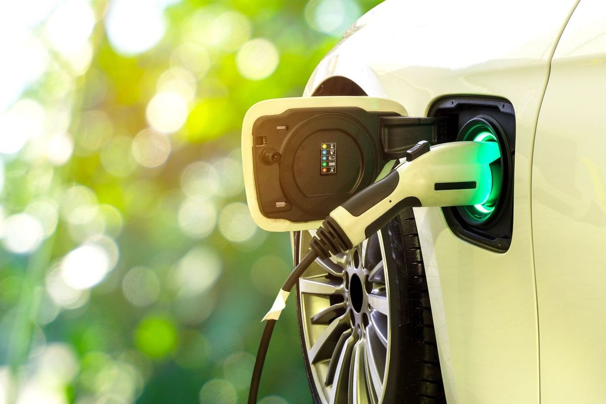 Closeup of electric vehicle charging lithium-ion battery, which requires minerals such as graphite.