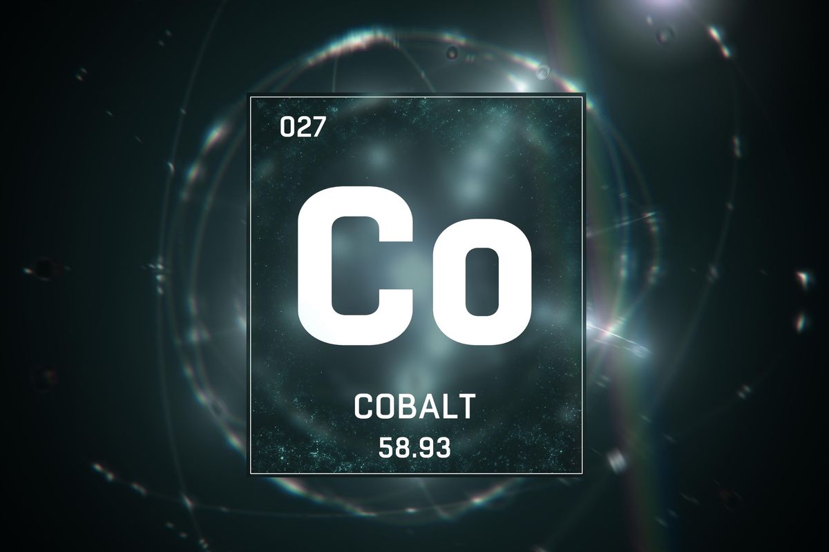 Cobalt symbol over glowing light pattern.