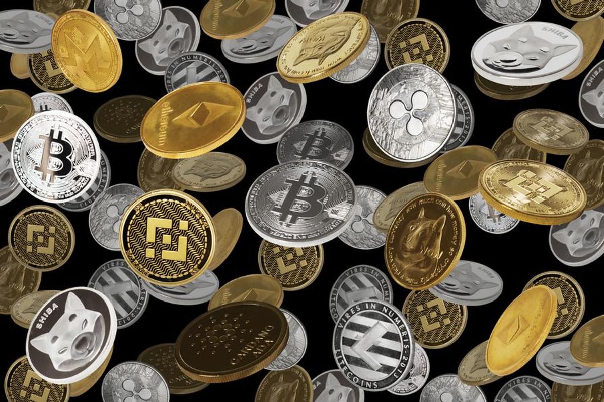 collection of physical coins representing cryptocurrencies