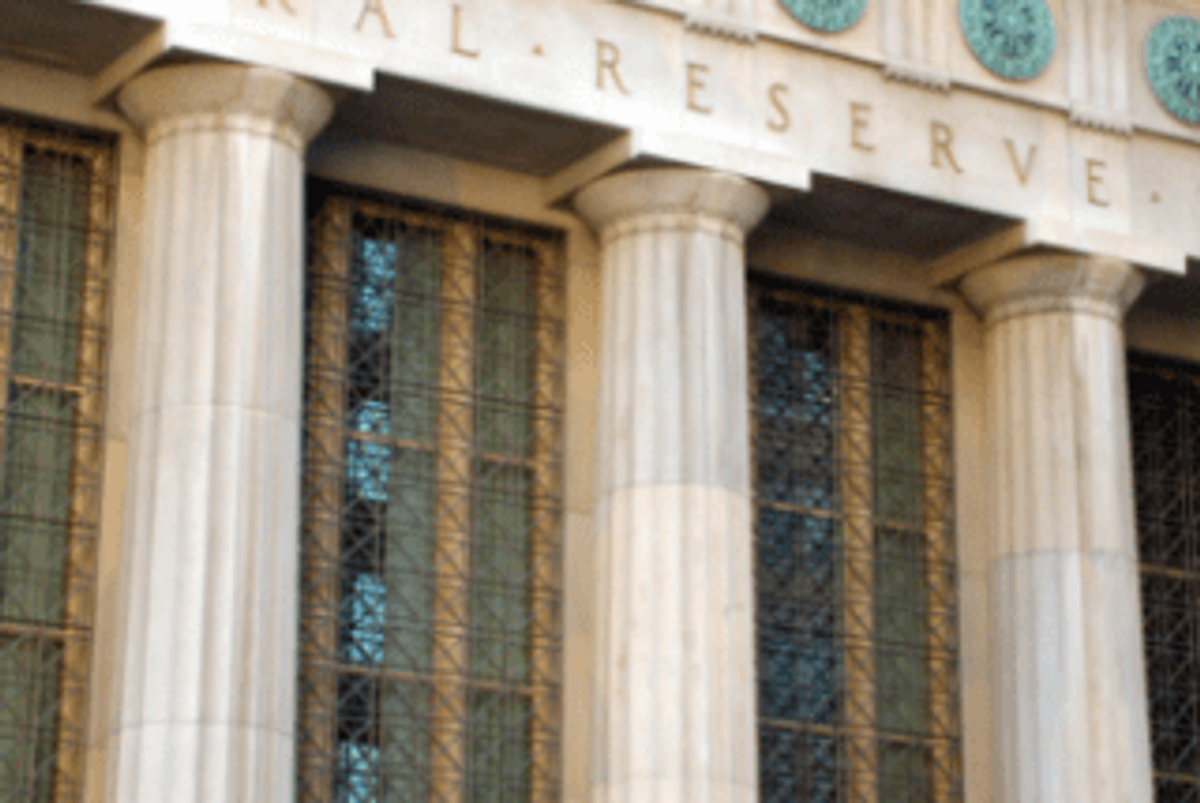 Columns of a neoclassical building with "Federal Reserve" visible above.