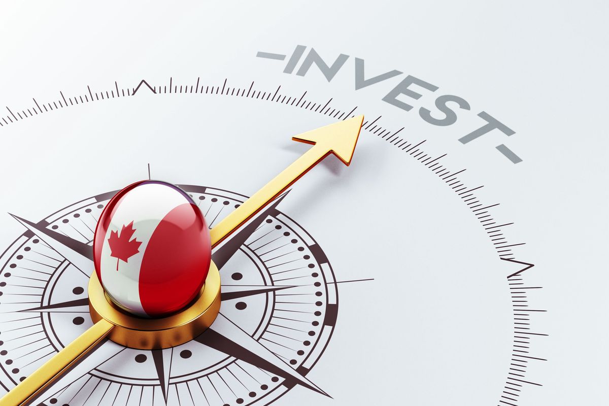 Compass with Canada flag pointing to the word "invest."