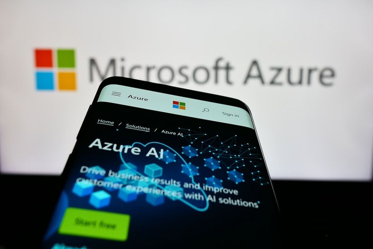 Computer and phone screens showing Microsoft Azure information.
