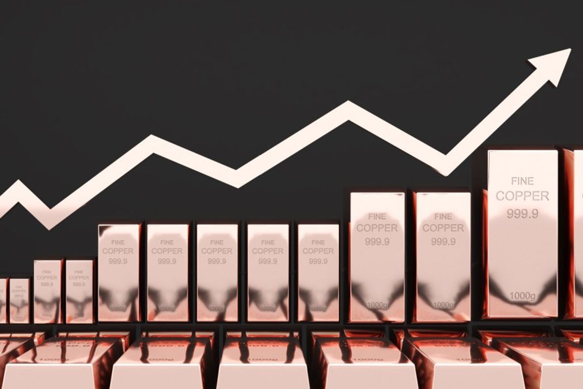 Copper bars in a row with arrow above ascending.