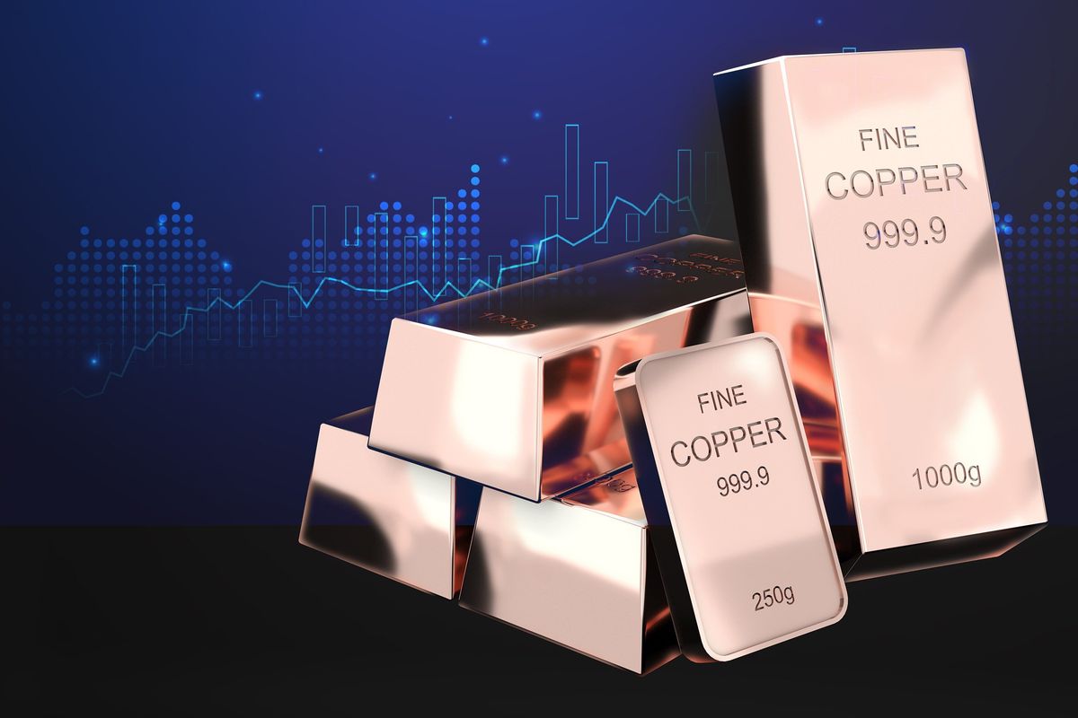 Copper bars with weight stamps, stock market chart background.