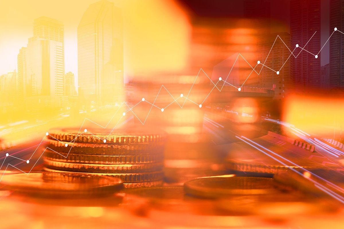 copper coins and chart going up