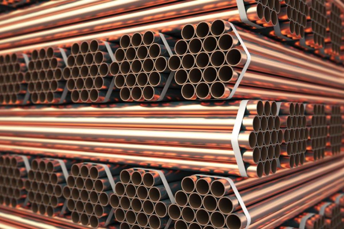 copper pipes laid on top of each other in bundles