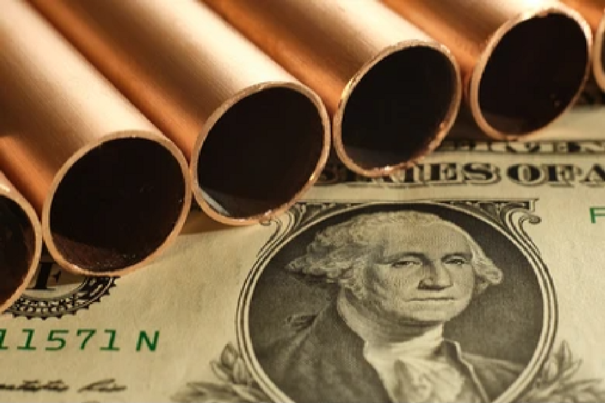 copper pipes on top of US bill