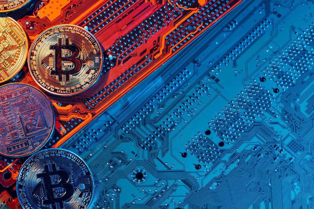 Crypto coins on circuit board.