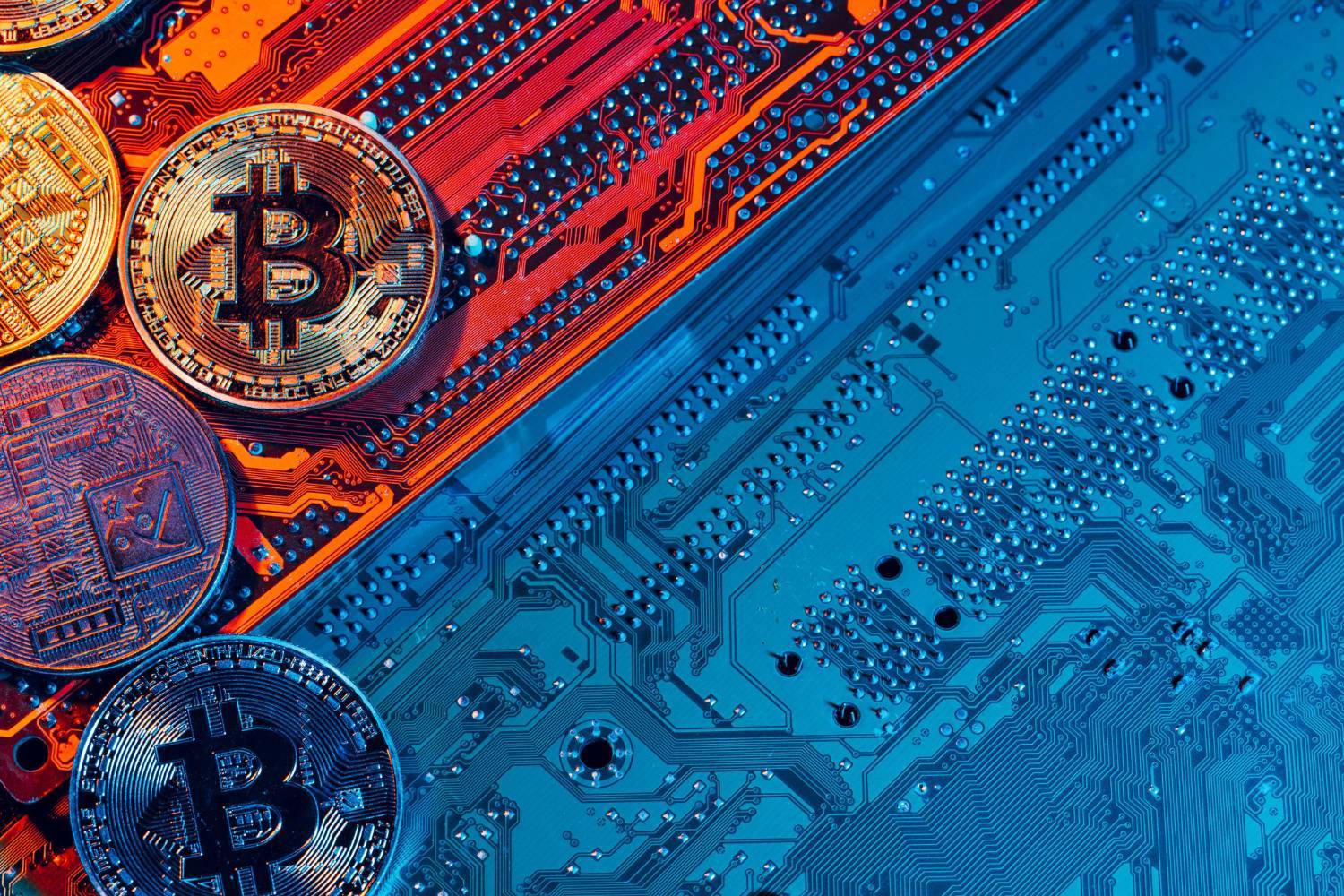 Crypto coins on circuit board.