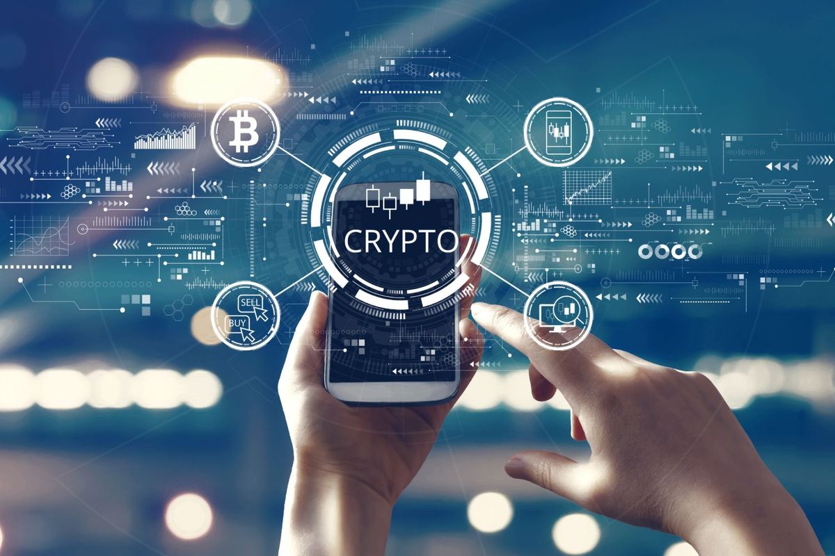 Crypto graphic imagery superimposed over hands holding cell phone.