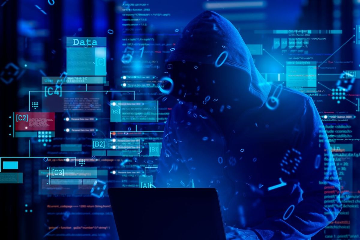 Dark figure on computer.