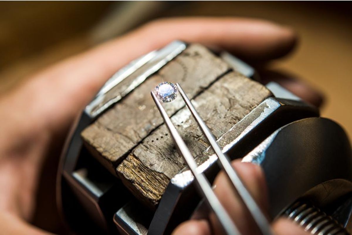 diamond held by tweezers