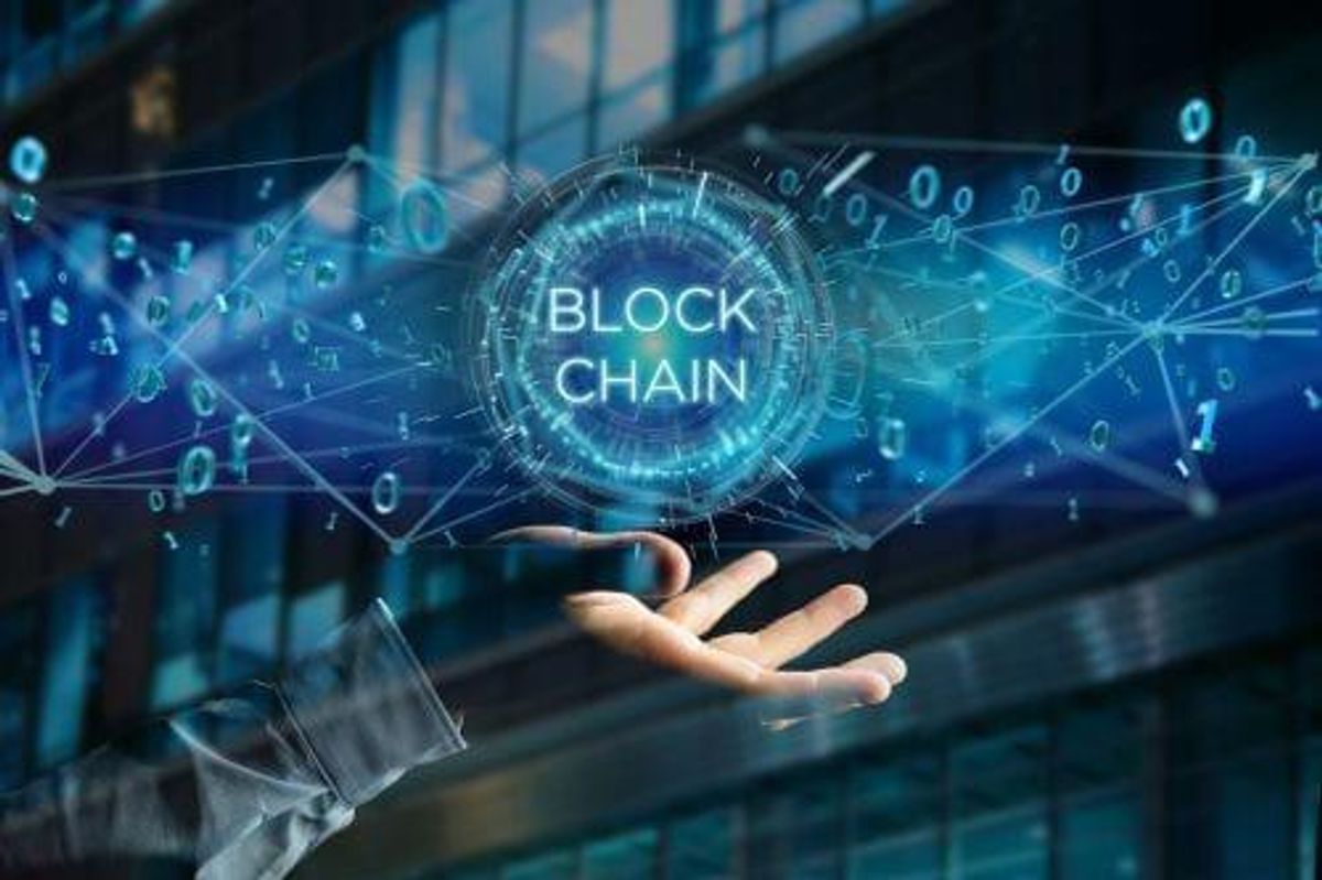 digital image of connected wires with a circle reading "blockchain" floating above a hand