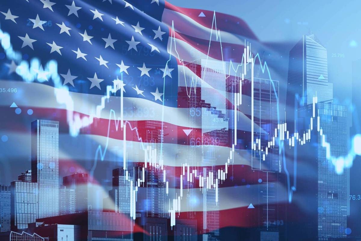 Digital stock market graph overlays skyscrapers and a translucent American flag.