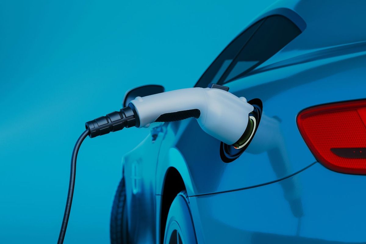 Electric vehicle charging with blue background.