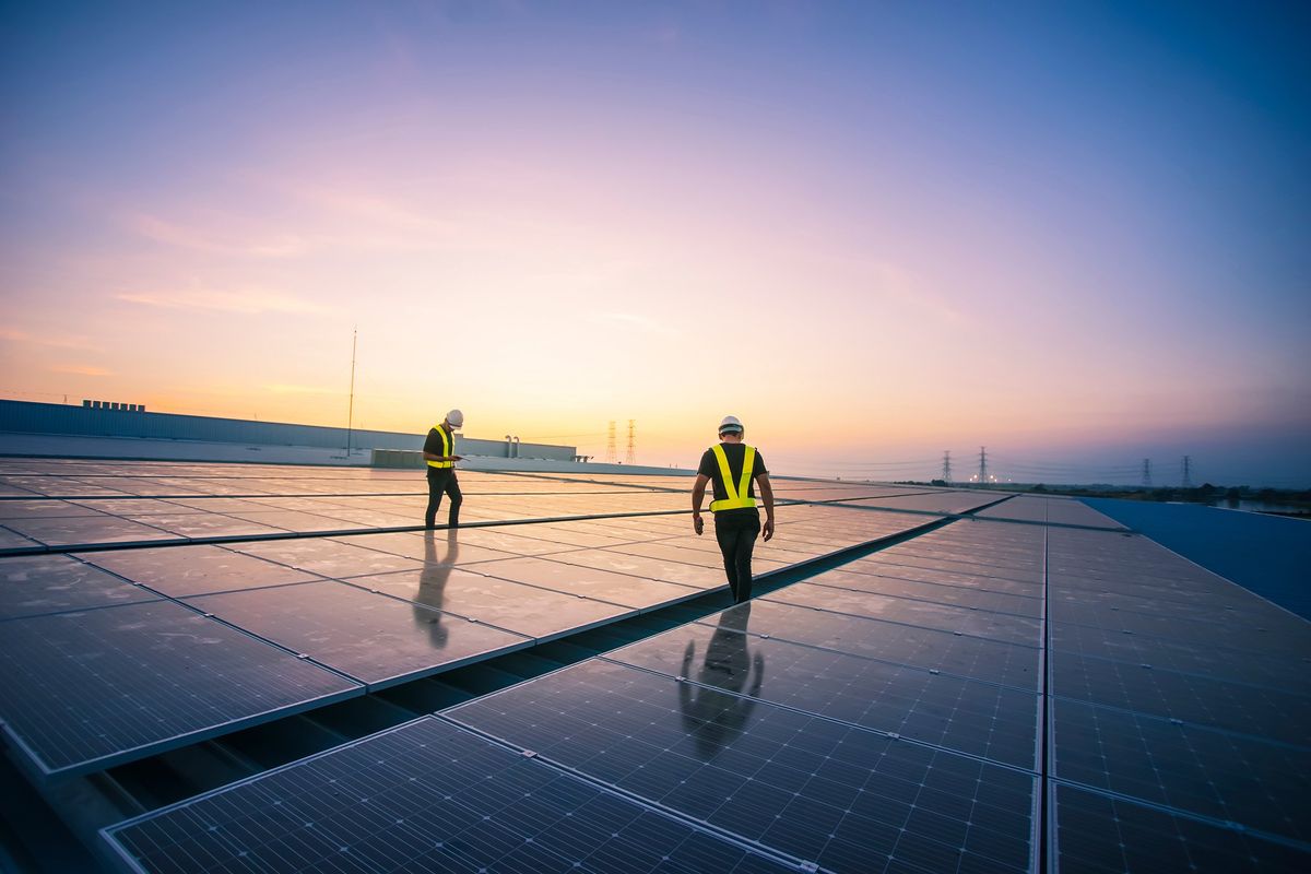 Engineers installing solar panels.