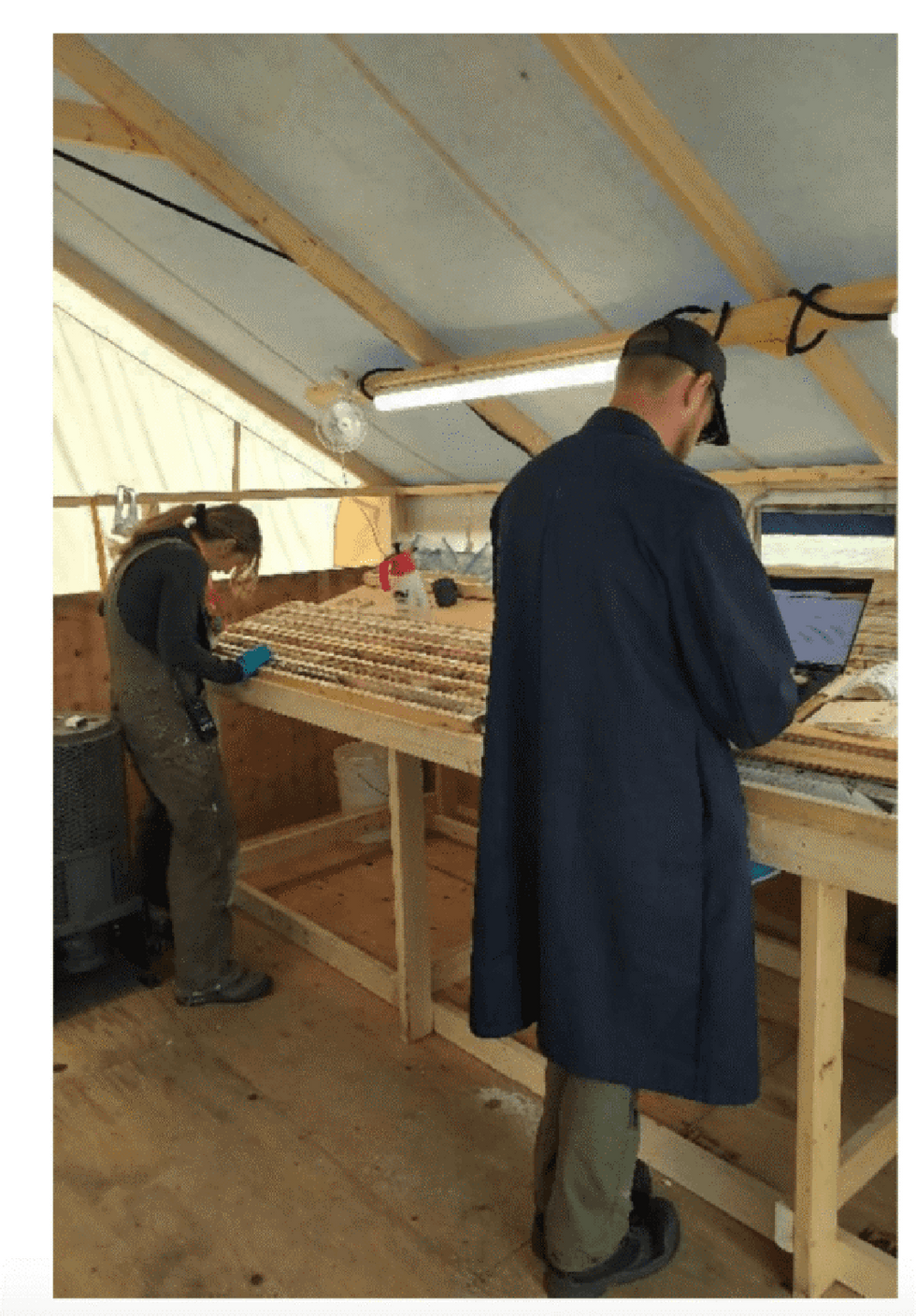 Examining drill core in the field at the Nunavut camp, August 2023