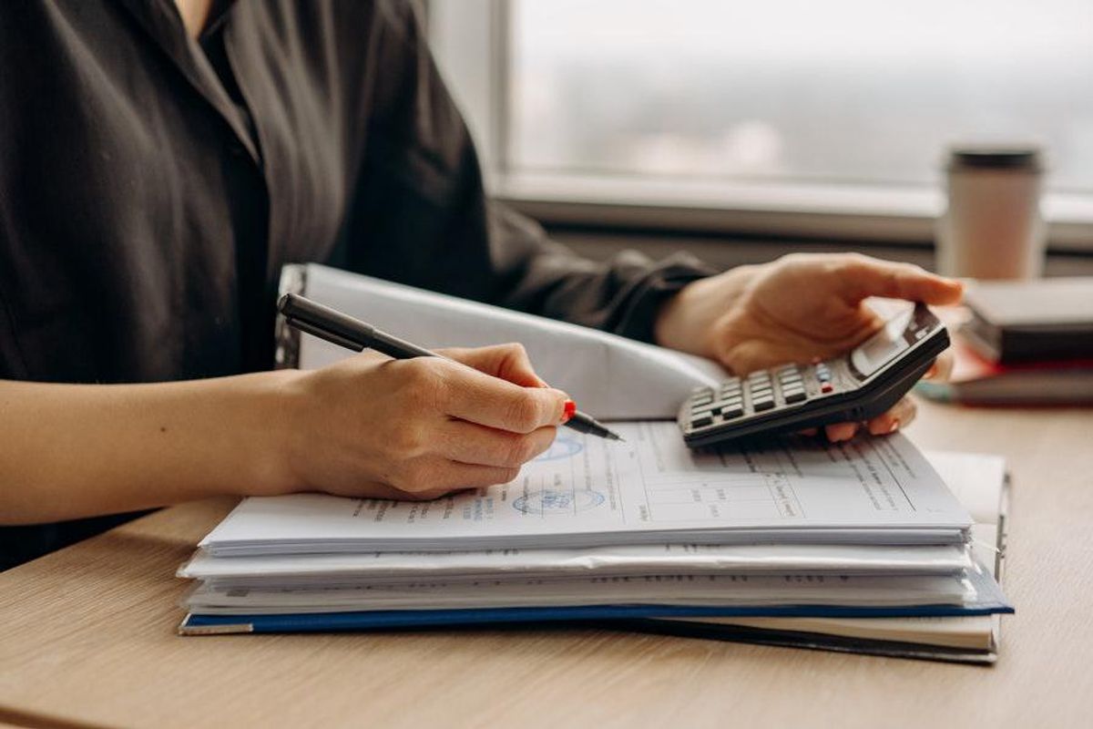 financial documents with a calculator
