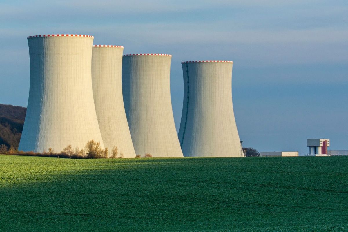 Four nuclear reactors in a field.