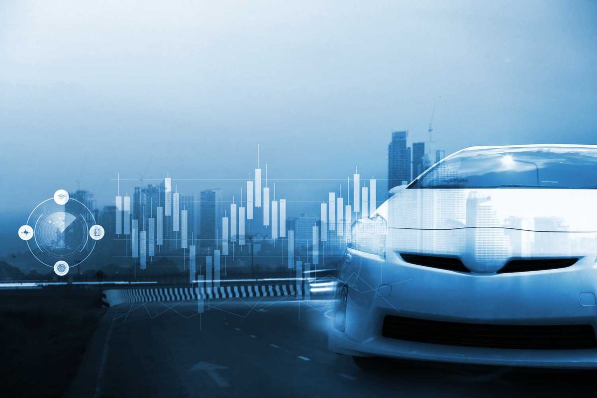 Futuristic car on a road with digital graphs and cityscape background.