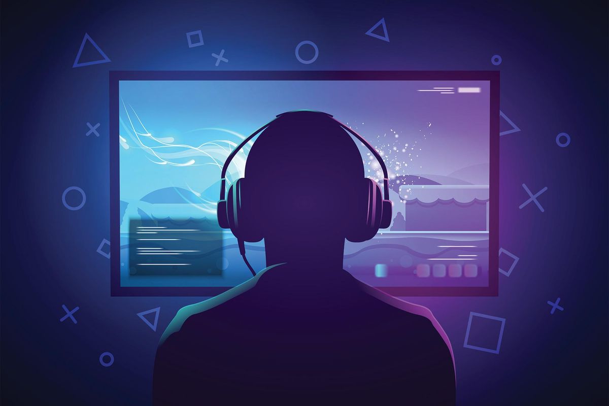 Gamer in front of computer screen.