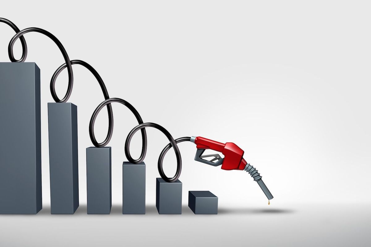 Gas nozzle with hose forming a declining bar graph, symbolizing falling gas prices.