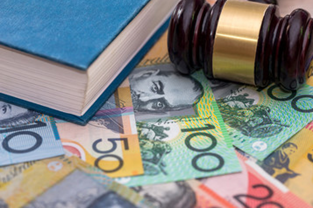 Gavel, book and Australian banknotes.