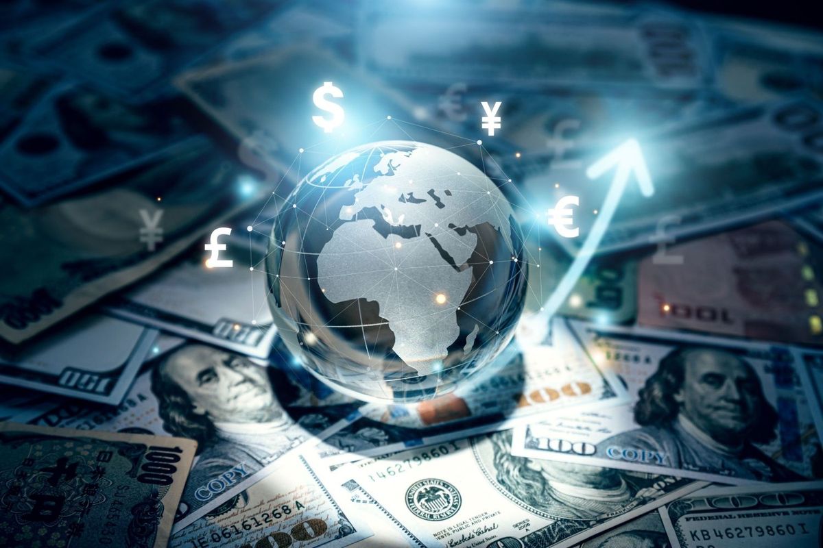 Globe on top of US money.