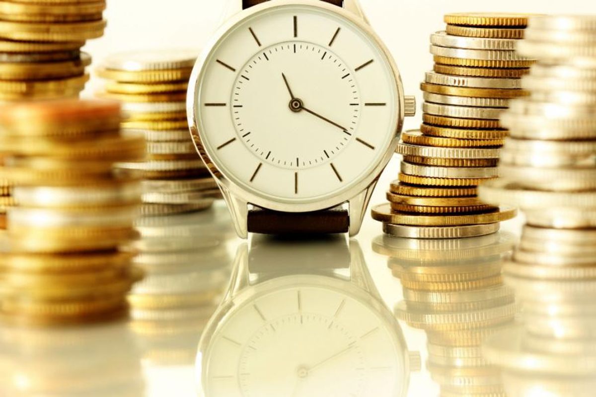 gold and silver coins with clock