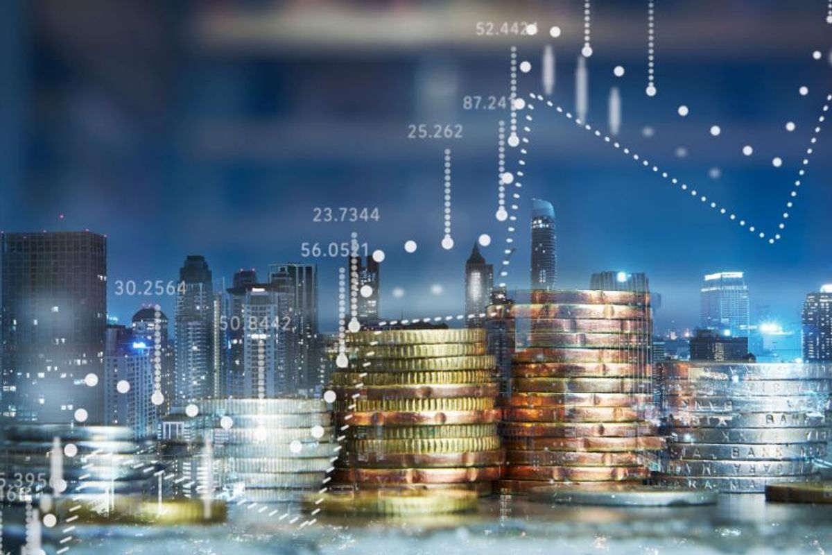 gold and silver coins with stock chart