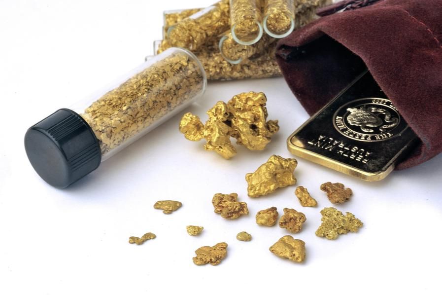 gold bar in pouch with gold nuggets