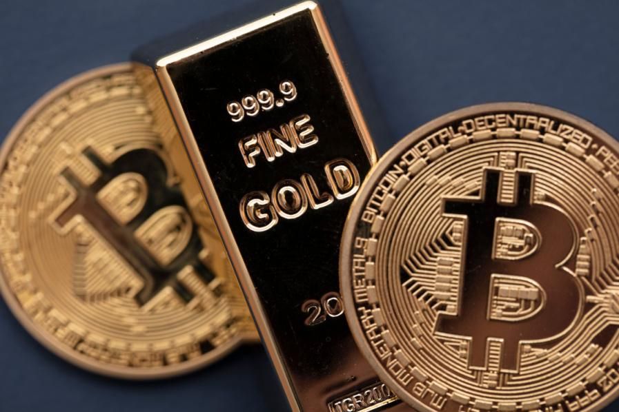 gold bar with physical bitcoins