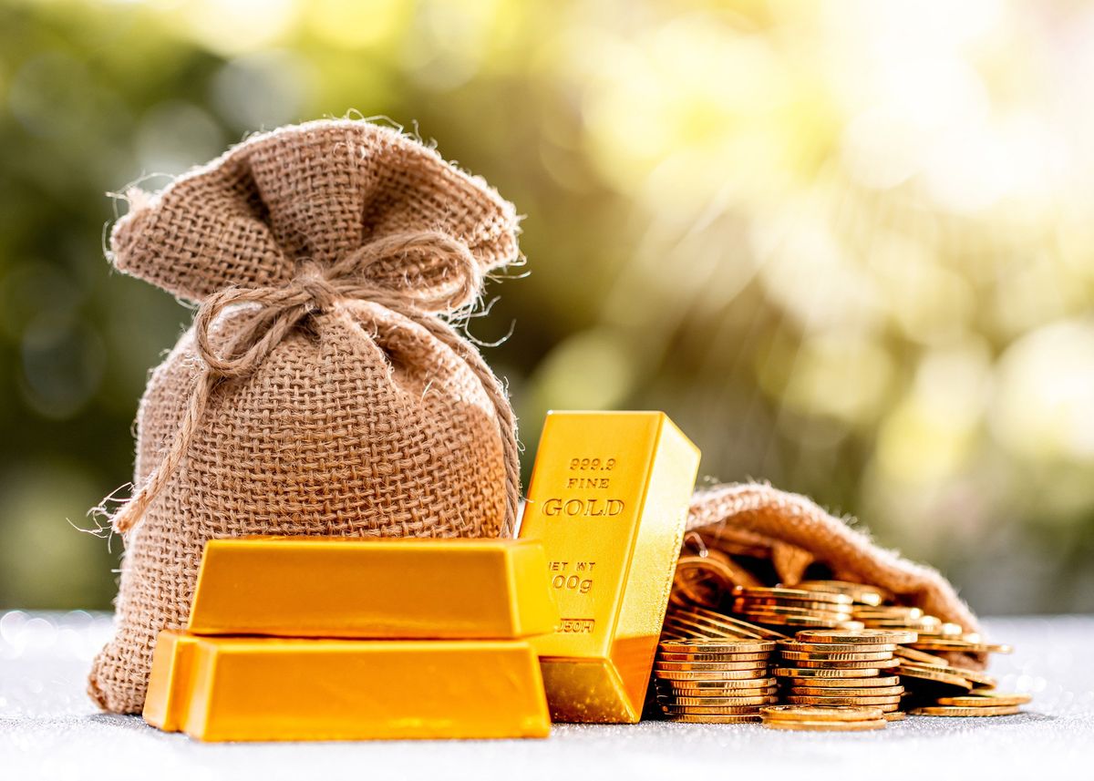 Gold bars and coins as well as a sac of gold.