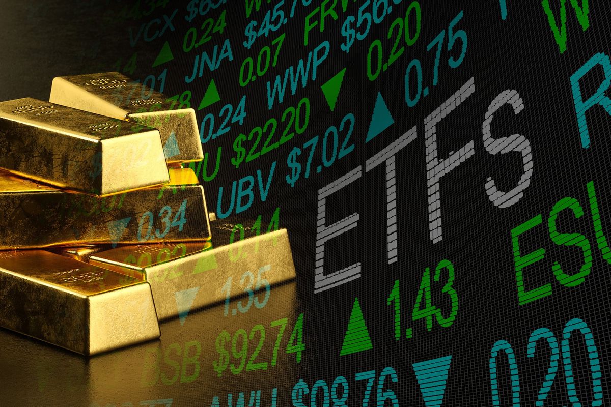 Gold bars and ETF stock chart.