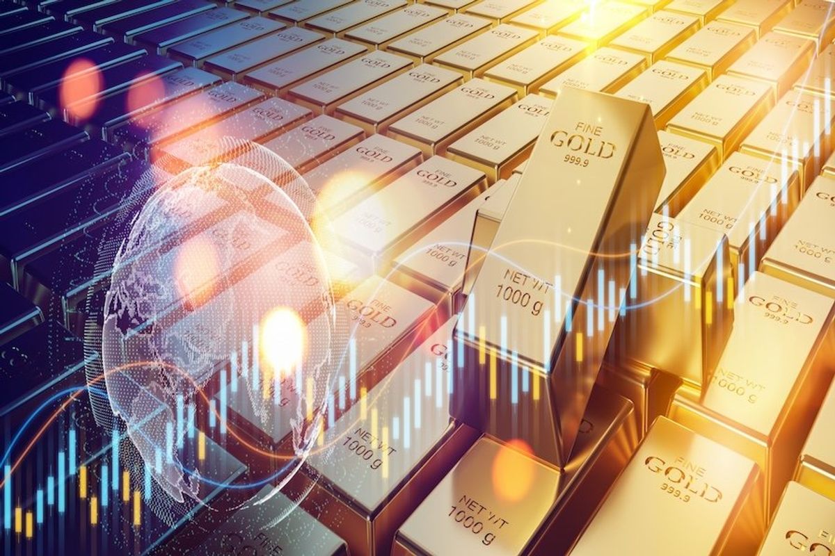Gold bars and stock chart.