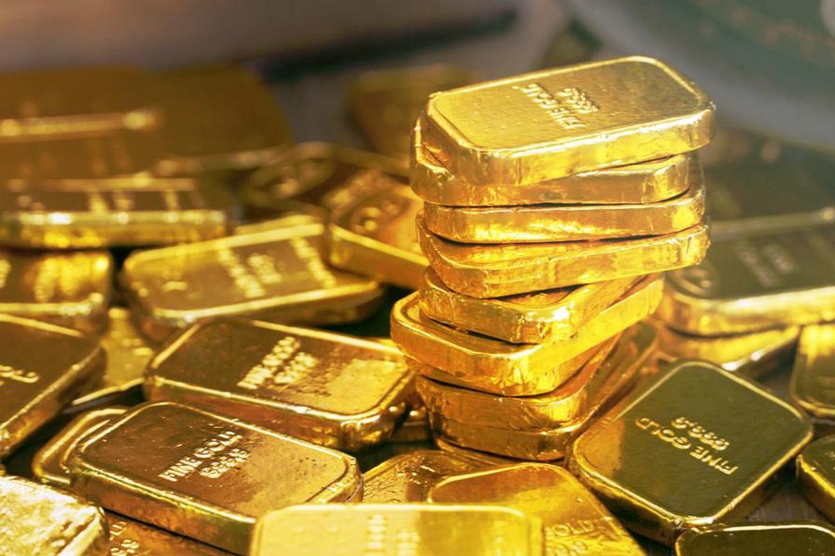 Gold bars in stacks.