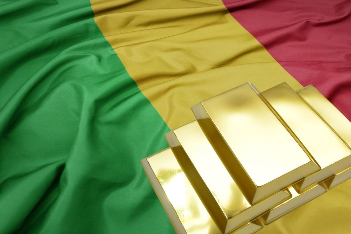 Gold bars laying on top of Mali flag.