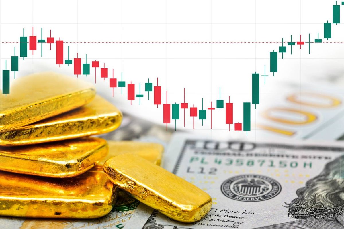 Gold bars on a hundred-dollar bill with a fluctuating stock chart background.