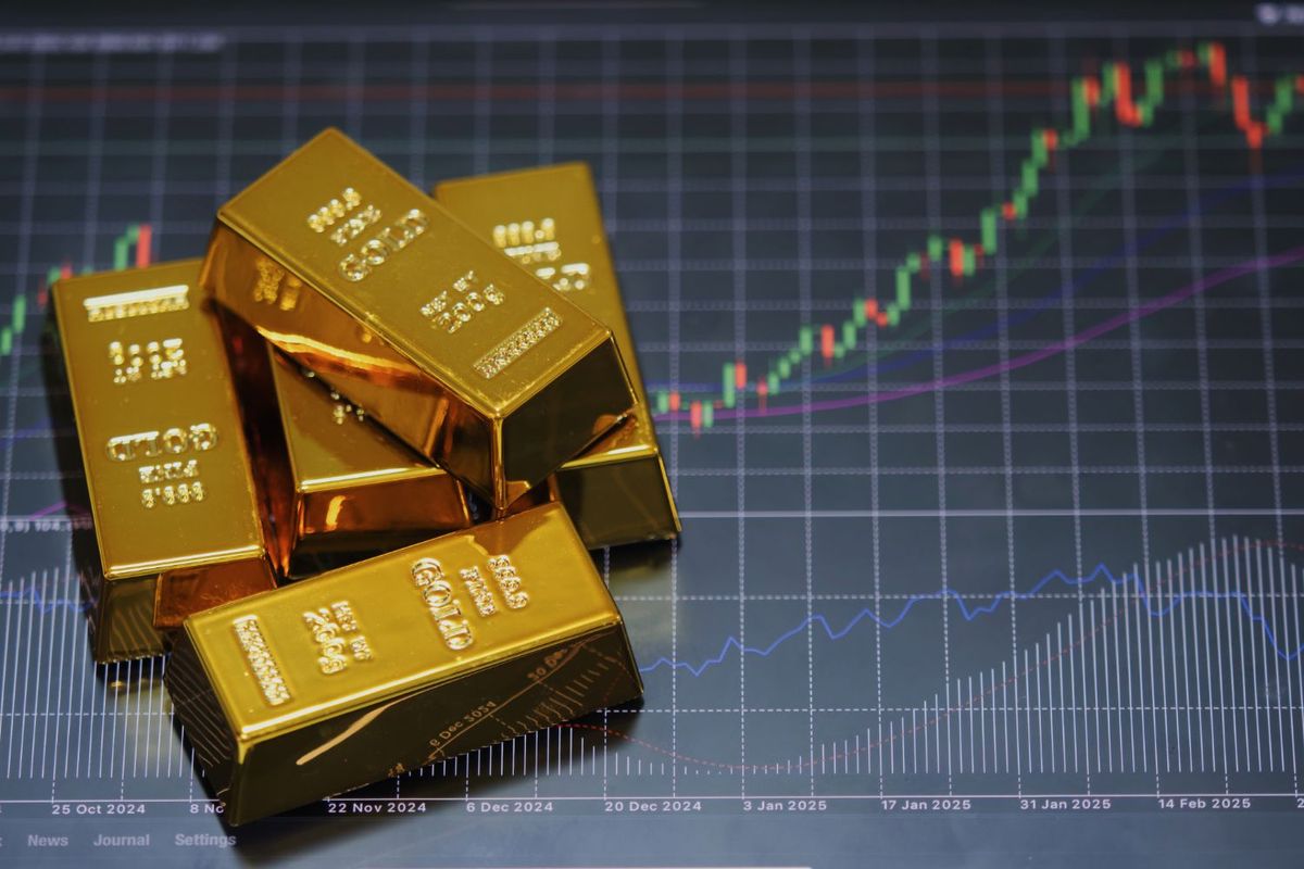 Gold bars on financial chart showing upward trend.