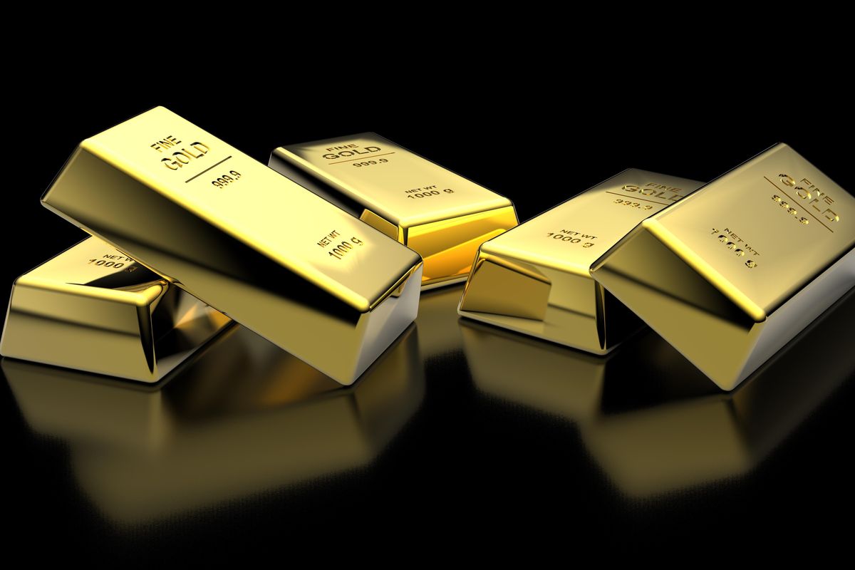 gold bars over shiny black surface