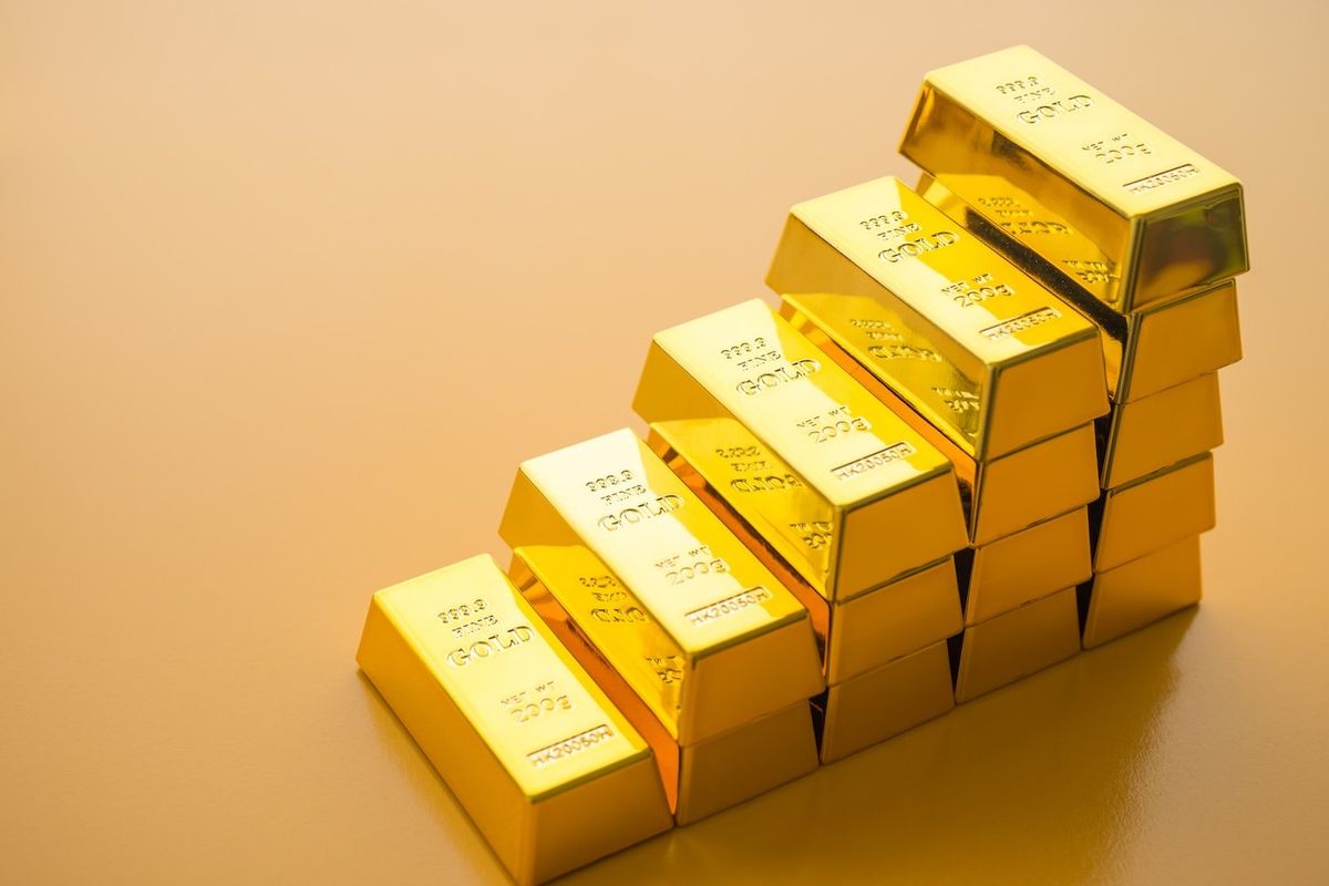 Gold bars stacked in ascending order.