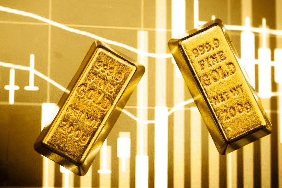 gold bars with stock chart