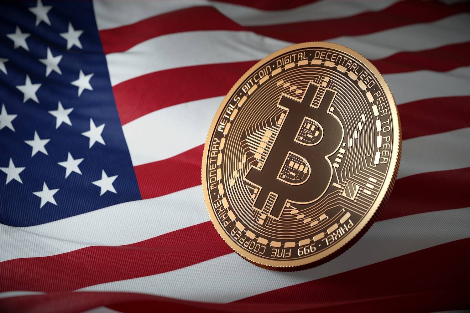 Gold Bitcoin placed over a waving American flag.