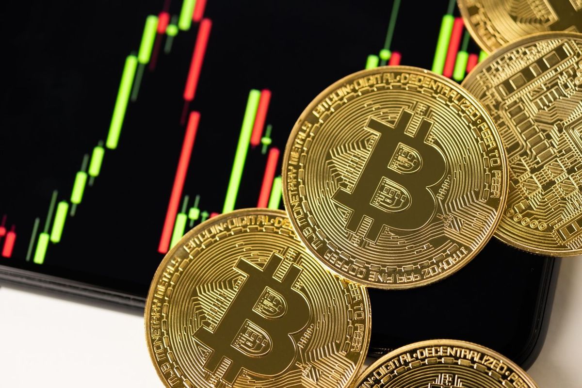 Gold Bitcoins with stock chart.